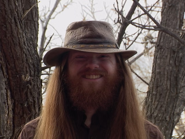 A headshot of Jareth McGhee smiling